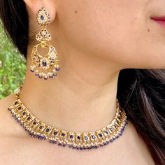 Featuring a delicate gold necklace with chandbali earrings studded with pearls and neelam (blue sapphires). This necklace is the perfect accessory for special occasions, delivering timeless elegance and exquisite craftsmanship. The necklace weighs 30.24 gms including 4.86 gms in the hanging pearls and blue sapphire beads. The long chandbali earrings weigh 17.5 gms including 1.75 gms in the hanging pearls and blue sapphires. Watch Product Video Price Breakup Summary Component Rupees % of Total 22 Elegant Blue Meenakari Necklace, Elegant Blue Kundan Necklace With Intricate Design, Blue Kundan Necklace For Reception Festivities, Blue Kundan Necklace For Festive Reception, Blue Kundan Necklace For Reception And Festive Occasions, Elegant Blue Kundan Necklace With Meenakari, Elegant Blue Jewelry Sets For Diwali, Elegant Blue Bridal Necklace With Intricate Design, Elegant Blue Kundan Necklace For Reception