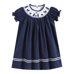 Navy Blue Corduroy Nativity Smocked Bishop Dress Charming and cute! Your little cuties closet is not complete without this adorable outfit. They will love spending their days in this outfit made out of 100% soft cotton. Cute details make it a one of a kind addition to their closet. This Bishop dress is the traditional length with hemline reaching the calf/ankle. From festive activities or just fun days at home your little sweetie will be ready and picture perfect! -100% Cotton -Machine Wash -Man Cute Smocked Dress For Playtime, Playful Cotton Smocked Playtime Dress, Playful Cotton Smocked Dress, Playful Cotton Smocked Dress With Smocked Back, Playful Cotton Dress With Smocked Bodice, Cute Smocked Dresses For Playdates, Preppy Cotton Dress For Playtime, Cute Smock Dress For Playdate, Cute Cotton Dress With Smocked Back