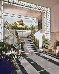 an artistic rendering of a staircase leading up to the top floor in a hotel lobby