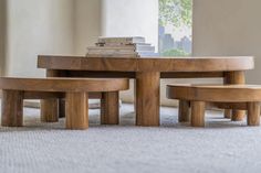 two wooden benches and a table with books on top