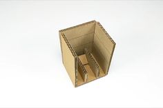 an open cardboard box on a white surface