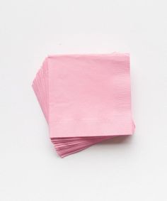 pink paper napkins stacked on top of each other