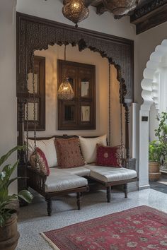 a living room with a couch, mirror and potted plant on the side wall