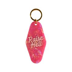 a pink keychain with the words radie hell on it's side