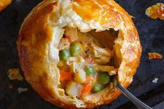 a chicken pot pie with a spoon in it