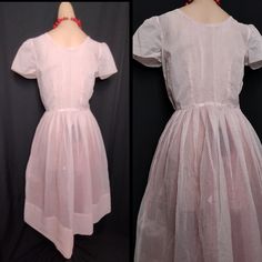 "Late 50s/early 60's fab party dressing sheer white organza with tiny raised red polkadots with a red tulle skirt to add volume! FEATURES - fit and flare style with fitted bodice & full pleated skirt -sheer swiss dot organza (faux, probably a rayon) - short cap sleeves - hidden metal zipper at side  -tie waist red tulle crinoline - perfect summer party dress! Size about a modern size small  Bust-36\" Waist-26\" Hip- free Length-45\" with a 6.5\" hem In good vintage condition. Shows some age/wear Fitted Vintage Style Summer Petticoat, Spring Party Fitted Petticoat, Spring Retro Petticoat, 1950s Style Fitted Party Petticoat, Vintage Pink Petticoat For Party, Fitted Retro Swiss Dot Dress, Pink Vintage Petticoat For Parties, Retro Fitted Swiss Dot Dress, Fitted Red Petticoat For Spring