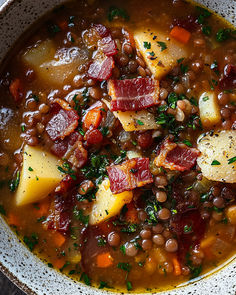 a bowl filled with beans, potatoes and meat