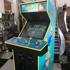 the simpsons arcade machine is on display in a store