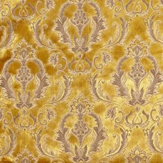 an old yellow and grey wallpaper with ornate designs