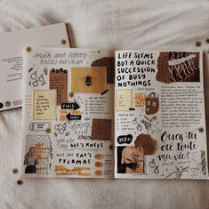 an open book on a bed with papers and stickers all over the spread out