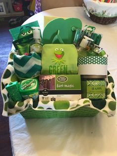 the green gift basket is full of goodies for someone's birthday or mother's day