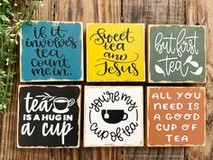 four coasters with different sayings on them sitting next to a potted plant