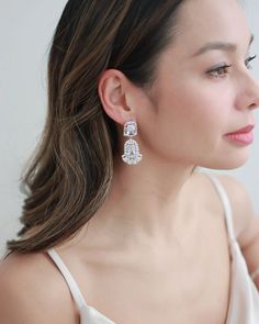 Make a statement on your wedding day with our Renee CZ Earrings. Crafted with CZs that sparkle like real diamonds. Lightweight for easy day to night wear. Wedding Dangle Earrings, Statement Wedding Earrings, Gatsby Earrings, Statement Earrings Wedding, Dangle Earrings Wedding, Freshwater Pearl Drop Earrings, Bridal Earrings Drop, Bridal Hair Clip, Wedding Hair Flowers