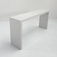 a white bench sitting on top of a white floor