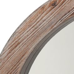 a wooden mirror is shown against a white background