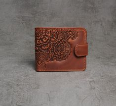 "Full grain leather wallet, soft leather wallet, leather billfold, small wallet women's, brown wallet, embossed billfold, pocket wallet, billfold wallet, gift for her Lovely embossed billfold wallet made from soft durable calf leather of premium quality. Dimensions: 9.5x11 cm (3.7х4.3\") 2 cash pockets, 4 card slots, 1 coins pocket, 1 photo pocket Like all of our products, this wallet will last for years, at the same time without losing its appearance. Please note! Since each item in my shop is handmade, some elements and tinctures may slightly differ." Vintage Brown Bifold Wallet As Gift, Vintage Brown Bifold Wallets As Gift, Embossed Brown Wallets As Gift, Brown Embossed Wallet For Everyday Use, Elegant Textured Leather Wallet, Classic Embossed Leather Wallet, Brown Embossed Wallet For Daily Use, Brown Embossed Wallets For Daily Use, Brown Embossed Wallet