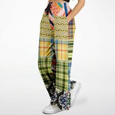 Introducing the Ginger Snap Boho Patchwork Eco-Poly Wide Leg Pants – a vibrant and stylish addition to your wardrobe. These eye-catching pants feature an eclectic mix of colorful patterns, perfect for making a bold statement. Made from durable Eco-Poly fabric, they offer a comfortable and sturdy feel. The elastic drawstring waist provides a customizable fit, while the hidden side seam scoop pockets add practicality without compromising on style. Due to its eclectic pattern and color mix, these p Eclectic Pattern, Boho Patchwork, Ginger Snap, Versatile Pants, Colorful Patterns, The Bohemian, Ginger Snaps, Color Mix, Bell Bottoms