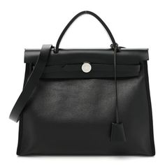 This is an authentic HERMES Toile H Berline Vache Hunter Herbag Zip PM 31 in Black and Ecru. This tote is crafted of coated canvas in black.This bag features a rear canvas hanging zipper pocket, a black vache leathertop crest, a leather top handle, a shoulder strap, and strap closure with palladium silver hardware. This opens to a canvas interior with a matching canvas pouch. High-end Coated Canvas Satchel With Detachable Strap, Black Luxury Coated Canvas Satchel, High-end Black Coated Canvas Shoulder Bag, Luxury Black Coated Canvas Satchel, High-end Everyday Satchel In Coated Canvas, High-end Coated Canvas Satchel With Top Handle, High-end Everyday Coated Canvas Satchel, High-end Black Coated Canvas Bags, Black Coated Canvas Bags For Office