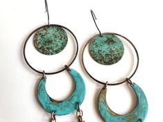 "Made to order. 1-2 week fabrication time frame. Brass naturally oxidized with Verdigris patina. Earrings hang from oxidized sterling silver ear wires. Measurement: 6\"x1\" Care: All of our patina pieces are sealed with a resin lacquer to help protect the oxidization, however we do recommend that you keep all patina pieces dry and away from water as it can further the oxidation process and potentially can alter the color. *Patina is a natural oxidation process so color shades may vary." Artistic Copper Earrings With Patina, Copper Dangle Earrings With Patina, Copper Dangle Jewelry With Patina, Unique Patina Copper Earrings, Unique Copper Earrings With Patina, Artistic Metal Jewelry With Patina, Rustic Bronze Earrings With Patina, Patina Brass Rust Jewelry, Rust-colored Brass Jewelry With Patina