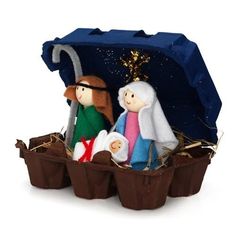 a nativity scene with three people in a manger