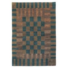 a brown and blue rug with squares on the bottom, in different colors or shapes