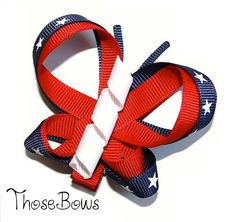 a red, white and blue bow with stars on it