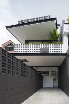 the entrance to an apartment building with black and white architecture