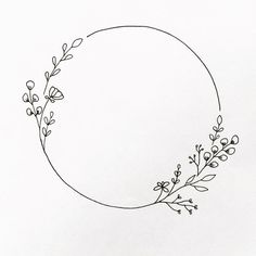 a black and white drawing of a circle with flowers on it