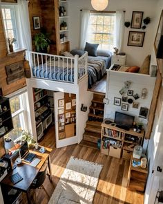 an aerial view of a living room and bedroom from the top floor to the loft