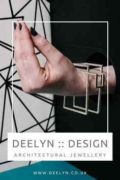 Silver statement bangle from the Entrapment collection - bold, architectural and geometric sculptural statement art jewellery by @deelyndesign - it's wearable art inspired by modern, contemporary architecture. Handmade in the UK by artist Deelyn Walsh. Art Jewelry