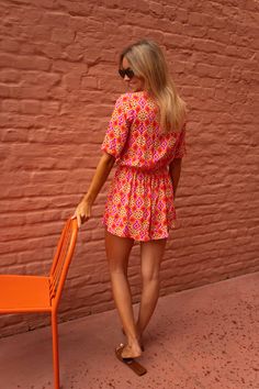 Designed to be both classy and casual, our flowy orange and pink romper is the ultimate addition to your summer clothing rotation. The romper is slightly short, and features short sleeves and a bow to tie the front opening. Though it is unlined, it is not sheer. Sizes: S-M / M-L S-M: Length 29.92 in - Width 12.20 in M-L: Length 30.71 in - Width 12.99 in 100% viscose Washing: handwash only Parisian Summer, Pink Romper, Pink Rompers, Orange Pattern, Orange And Pink, Summer Clothing, Chelsea, Rompers, Short Sleeves