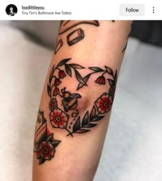 a woman's arm with tattoos on it and a tattoo design in the shape of a heart