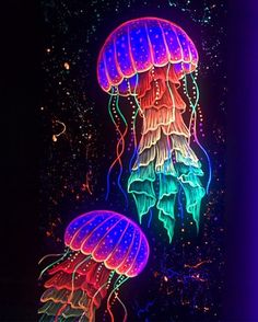 two glowing jellyfishs floating in the dark water with bubbles on it's sides