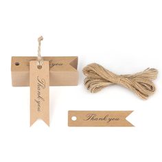 some twine and tags on a white background with the words thank you written on them