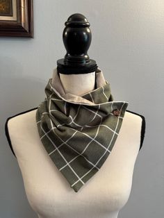 **Ready to Ship** Handmade soft cotton flannel bandana style scarf. Sage green window-pain flannel with white lines, lined with soft grey flannel, and one brown button with coordinating buttonhole.  Perfect accessory to keep you warm and stylish for the fall and winter.  Easy to wear with your coat in the winter and over a sweater. Makes a wonderful gift for yourself or anyone who wants to be cozy! The finished size is approximately 30 inches in length and 9 inches wide, wear it as part of your outfit or as a scarf for those chilly outings! Easy all-day wear without the bulk of a full scarf. This scarf is: -Made of soft cotton flannel and in a smoke-free environment. -Machine wash delicate cold. Tumble-dry low. *Fabric may shrink in the dryer* recommend hanging to dry to prevent fabric fro Casual Cotton Bandana For Outdoor, Casual Cotton Scarves For Winter, Casual Cotton Winter Scarves, Green Cotton Casual Bandana, Casual Green Cotton Scarves, Casual Green Cotton Bandana, Casual One Size Winter Bandana, Casual Winter Bandana, Green Casual Scarves One Size