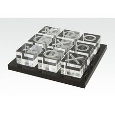 a black and clear plastic box with six different types of objects in it on a white background