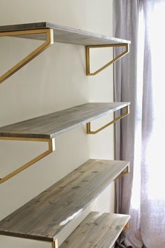 the shelves are made out of wood and metal