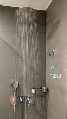 a shower head with thermostaer attached to it