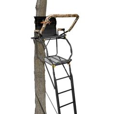 a ladder that is attached to a pole with a chair on it and a tree in the background