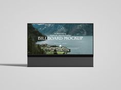 an image of a billboard mockup with mountains and lake in the background for advertising