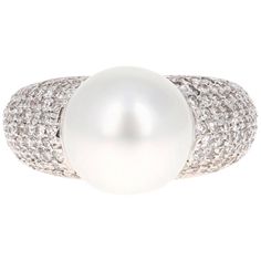 This dome like South Sea Pearl Ring is a remarkable beauty...0.90 Carat South Sea Pearl Diamond White Gold Cocktail Ring The lustrous White South Sea Pearl is 10 mm with 135 Round Cut Diamonds that weigh 0.90 Carats. It is delicately crafted in 14K White Gold. The ring is a size 6 and can be resized at no additional charge. Luxury Cubic Zirconia Round Cut Pearl Ring, Luxury White Pearl Ring With Single Cut Diamonds, Cocktail Ring Designs, Pearl Cocktail Ring, Golden South Sea Pearls, Fancy Yellow Diamond, Pearl And Diamond Ring, Contemporary Ring, Gold Cocktail Ring