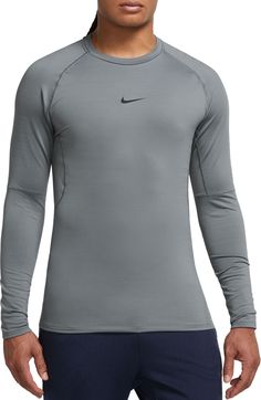 Fit & Design: Long sleeves Crewneck Rounded hem gives you extra coverage for your stretching routines and all your multi-direction movements Added length helps the top stay tucked in Mesh panels on the back and under the arms add ventilation and keep you cool French terry fabric has stretch for a body-hugging feel and provides smooth warmth Technology: Nike Dri-FIT technology moves sweat away from your skin for quicker evaporation, helping you stay dry and comfortable Nike Stretch Tops For Light Sports, Fitted Gray Training Top, Fitted Gray Top For Training, Fitted Moisture-wicking Athletic Heather Top, Nike Gray Stretch Top, Nike Stretch Running Tops, Nike Stretch Tops For Running, Fitted Technical Gray Tops, Sporty Fitted Athletic Heather Top