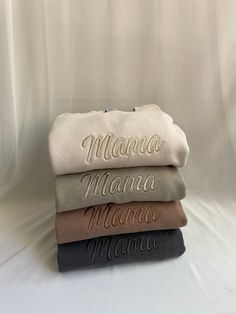 three personalized blankets stacked on top of each other with the word mama printed on them