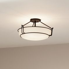 an overhead light fixture in a room