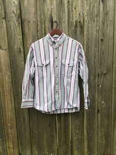 This is a great button up that isn't flashy or crazy, just simple and cool. It will look great with anything and is ready to go. It is in great condition and has no rips, holes, stains or smells. Measurements: Pit to pit: 22 1/4 inches Collar to bottom front: 23 3/4 inches Collar to bottom back: 26 inches Sleeve Length (from collar): 27 3/4 inches Size on tag: Medium 90s Fall Button-up Tops, 90s Style Collared Shirt With Button Closure, 90s Style Cotton Button-up Shirt, 90s Style Cotton Shirt With Buttons, 90s Style Long Sleeve Shirt With Button Closure, Biker Shirts, Vintage Vans, Button Dress, Button Up Shirt