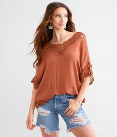 Women's Macrame Top In Brown By Daytrip., Women's Henna Textured knit handkerchief hem top Bust measures 42 on size small Body length 23 on size small. 100% Polyester. Hand wash cold. Do not bleach. Lay flat to dry. Cool iron if needed.. Measurements: Bust -Fullest part of bust with arms at sides. Waist -Circumference of natural waist: above belly button below rib cage. Hips -Standing with feet together fullest part of hips. WOMEN'S TOP SIZE CONVERSION CHART Size US/CAN BUST WAIST XXS 00 29-30 2 Fall Crochet V-neck Top With Crochet Trim, Knit Tops For Vacation In Fall, Short Sleeve Open Knit Tops For Vacation, Vacation Open Knit Short Sleeve Tops, Bohemian Pointelle Knit Crochet Top With V-neck, Short Sleeve Knit Top For Vacation, Beach Tops In Pointelle Knit For Fall, Pointelle Knit Beach Tops For Fall, Bohemian V-neck Pointelle Knit Top