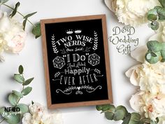 two wise nerd's wedding chalkboard sign with white flowers and greenery