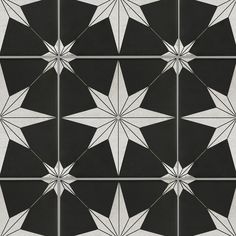 a black and white tile pattern with stars on the bottom, one star is in the middle