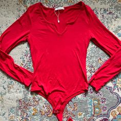 Brand New; Runs A Bit Big Red V-neck Bodysuit For Spring, Spring Red V-neck Bodysuit, Trendy Red Long Sleeve Bodysuit, Red Long Sleeve Bodysuit For Spring, Red Casual Bodysuit For Night Out, Casual Red Bodysuit For Night Out, Red Casual Bodysuit For Spring, Casual Red Bodysuit For Spring, Red Bodysuit For Night Out In Spring