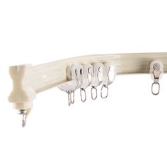 five hooks hang on the side of a white curtain rod with clips attached to it